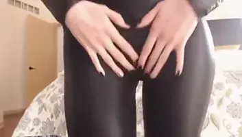 Stunning black latex catsuit girl